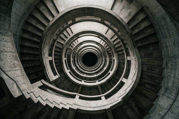 How to break the cycle of overthinking, spiral concrete staircase viewed from above