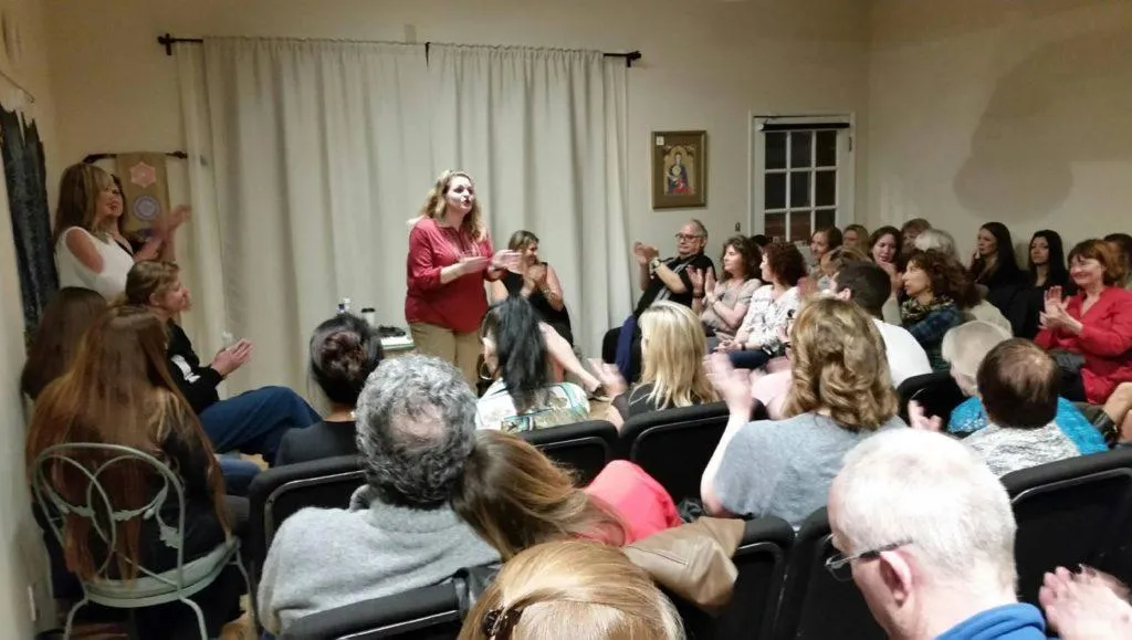 Image of Terrie Huberman speaking to a crowd o