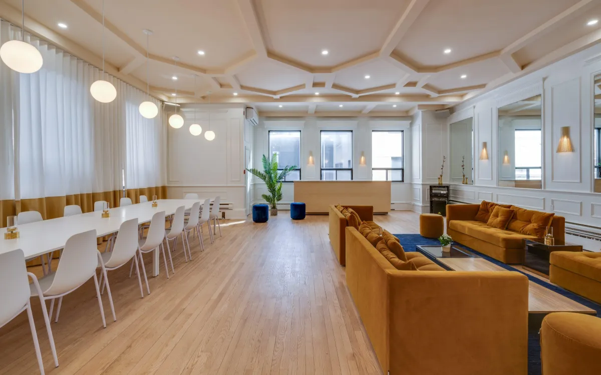 A man sitting at a table with glasses of wine
