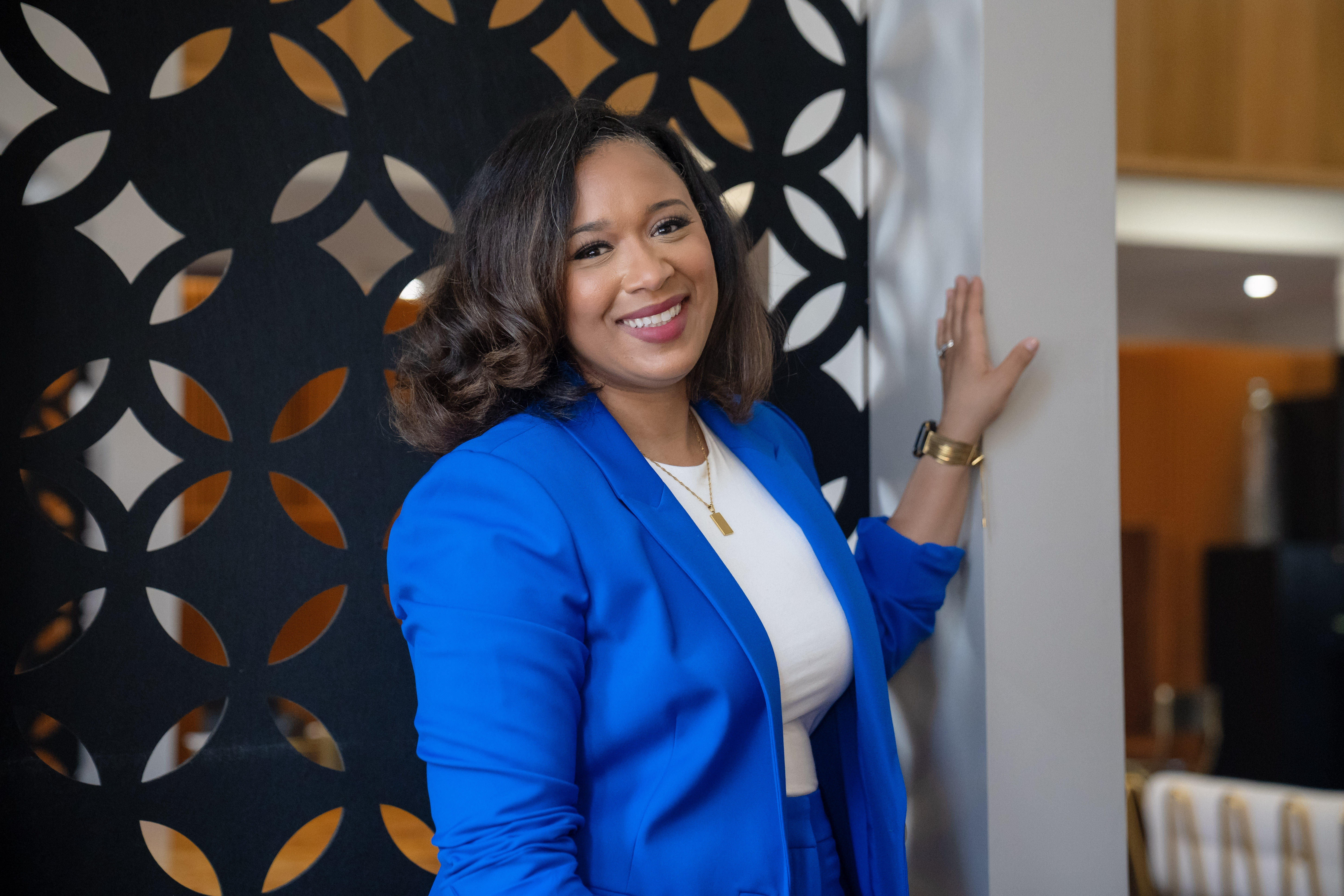 Casey Ferrand McGee smiling in a blue blazer