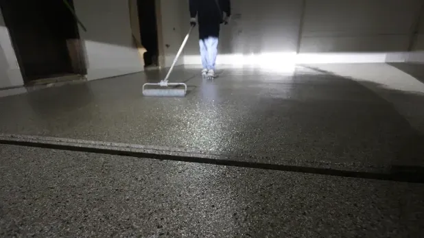 Level x employee servicing a garage