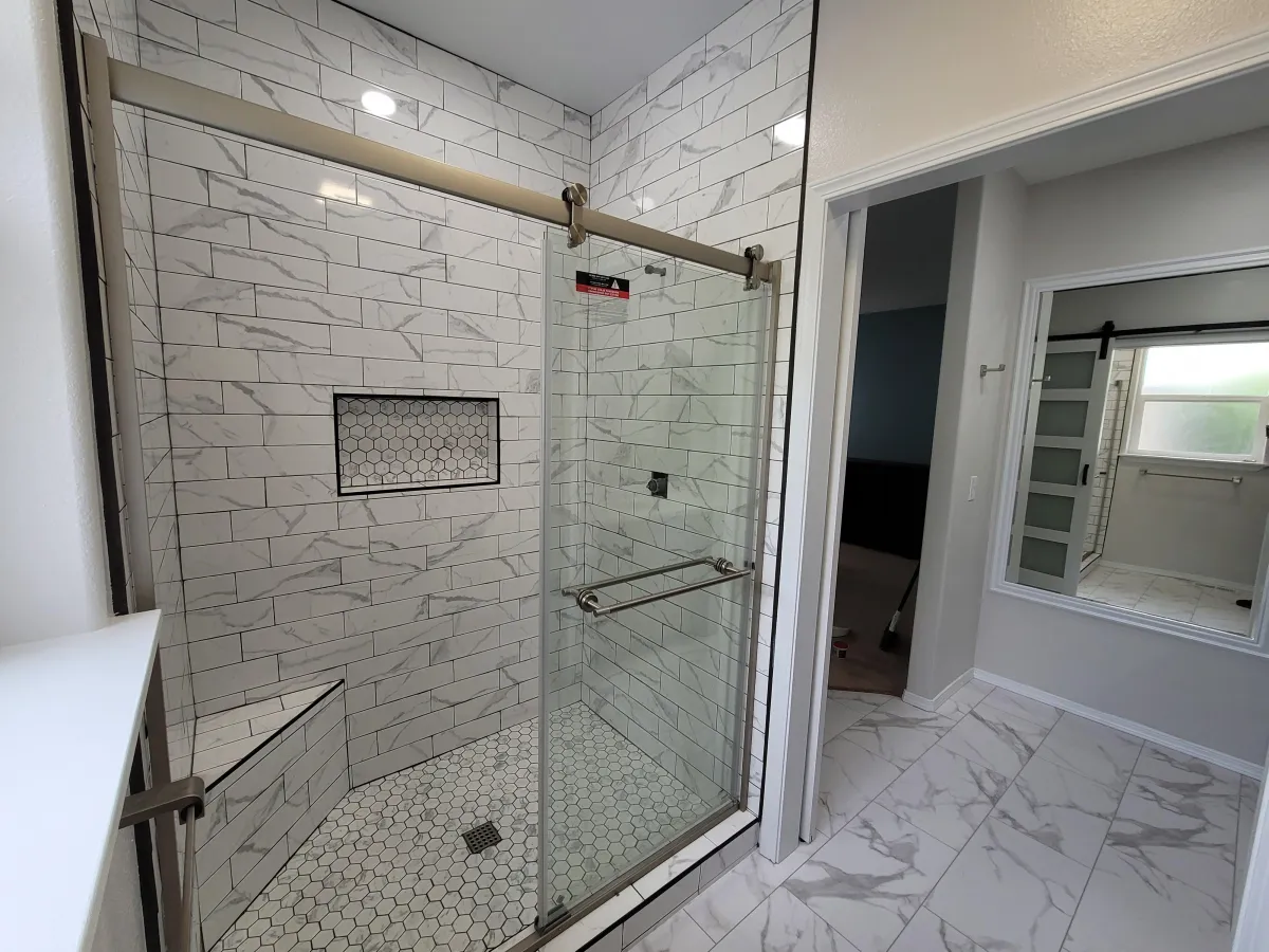 a modern kitchen with a bar and stools