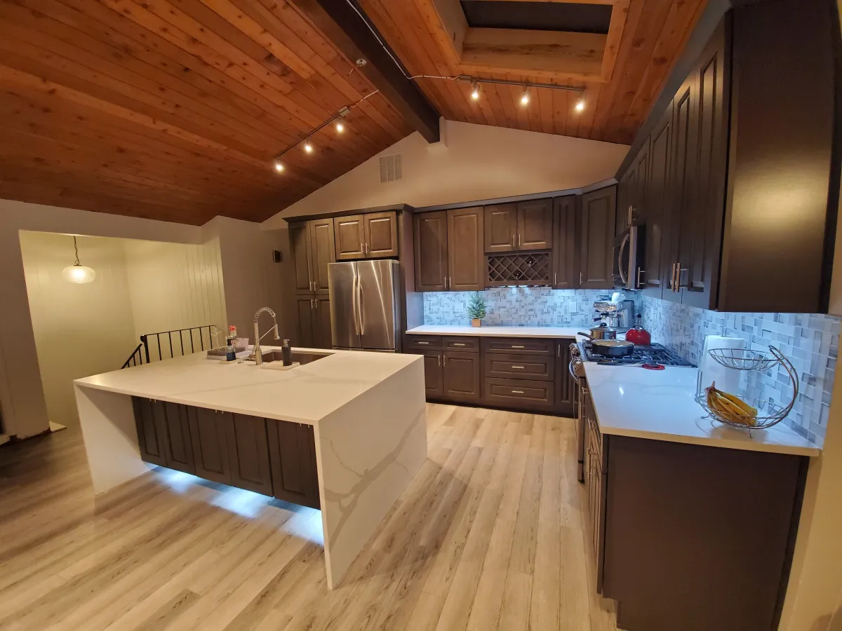brown wooden house near green trees during daytime