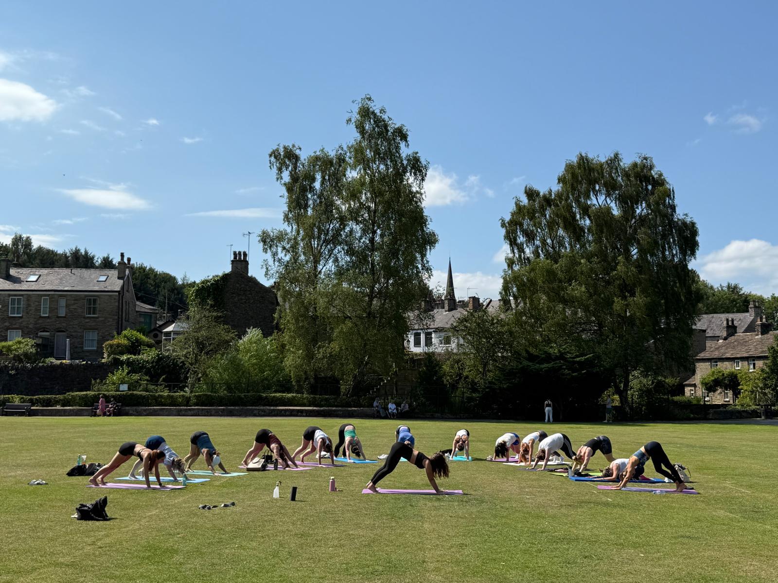 Calm lake surrounded by lush green trees and foliage.