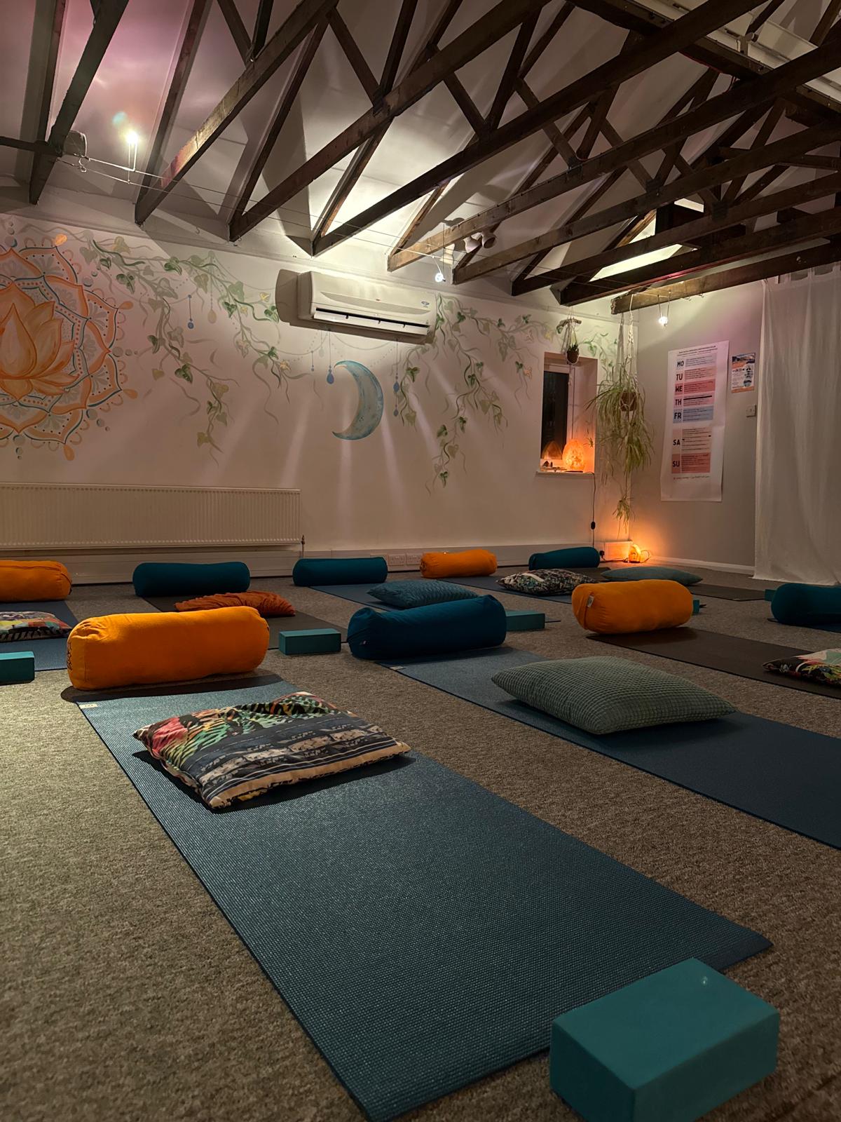 Woman practicing yoga on mat in park