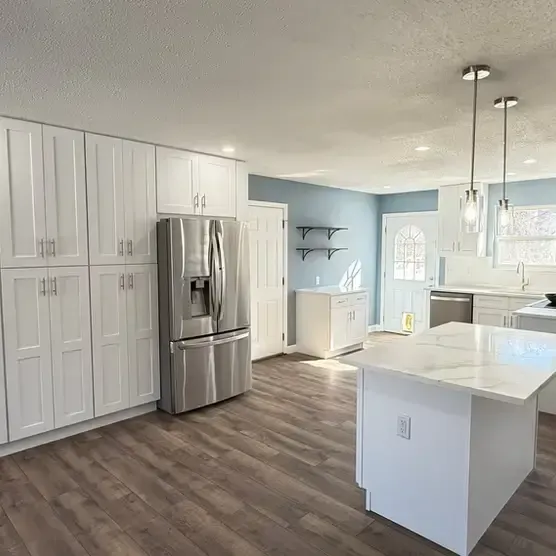 Full-service kitchen remodel contractors near me refinishing hardwood floors in St. Louis home