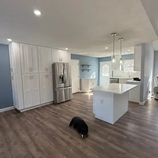 Before-and-after kitchen redesign by local St. Louis remodelers, featuring open-concept layout