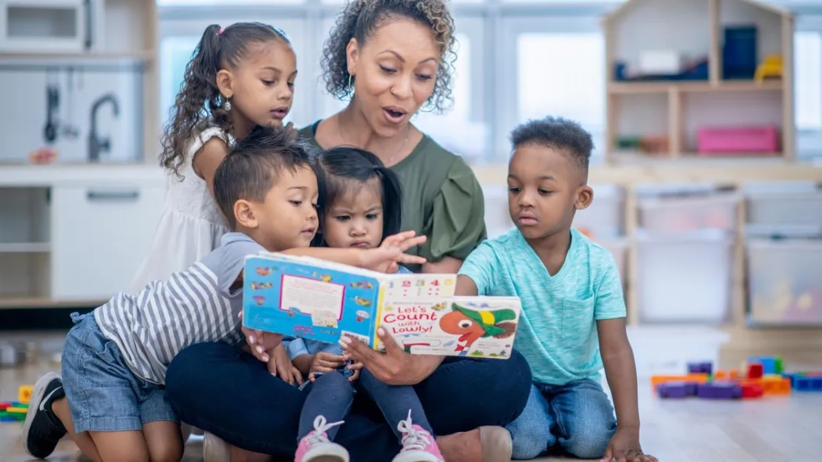 a boy and girl playing in the sand