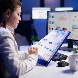 Team meeting at night with laptops for strategy session