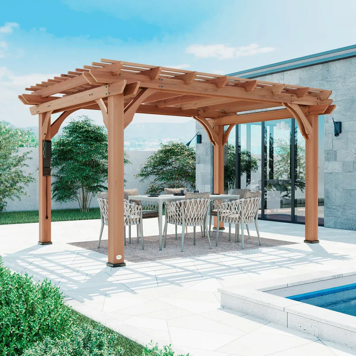 Large wooden backyard pergola with metal roof placed beside a swimming pool and dining setup.