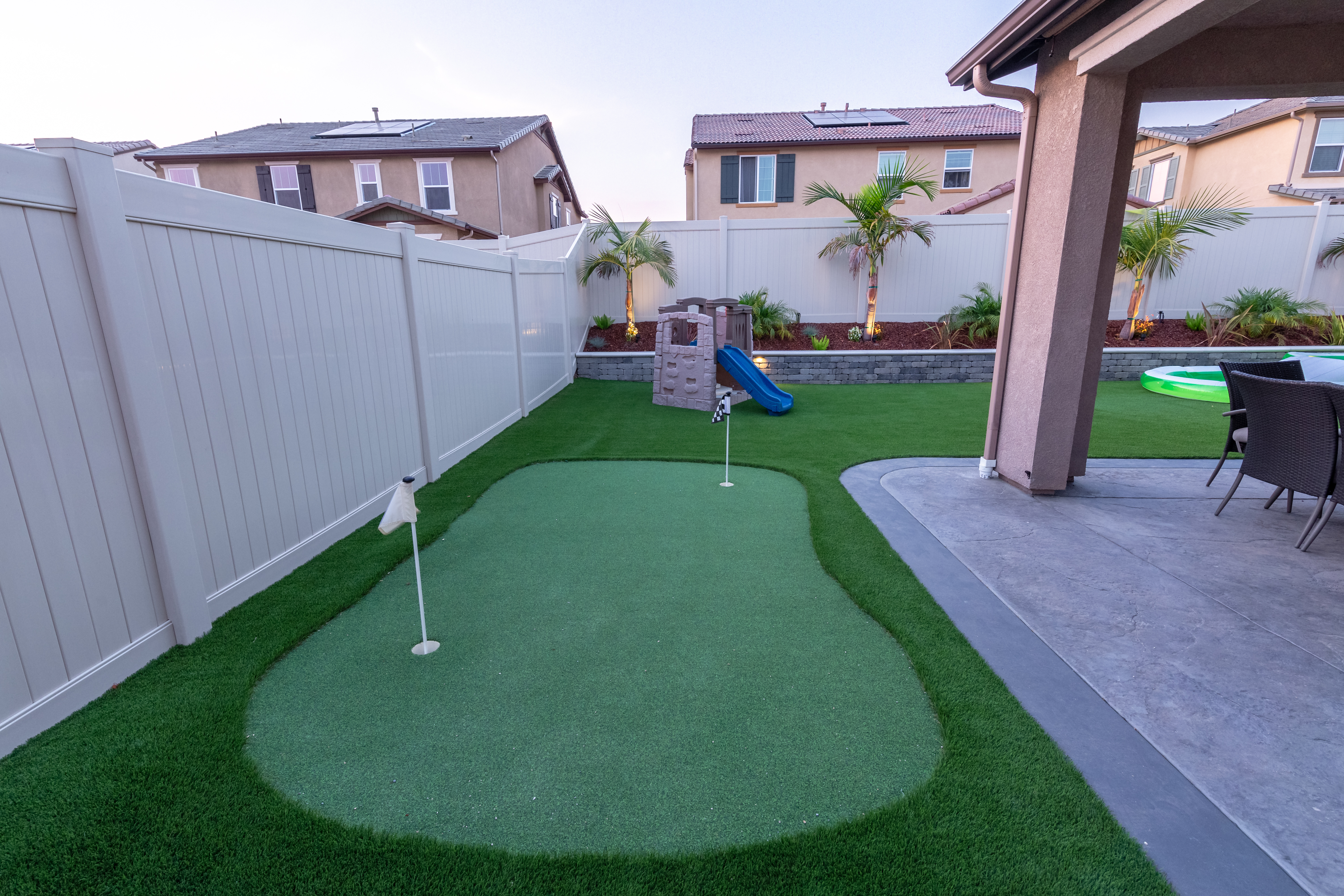 Completed backyard turf and paver installation by Coronado Turf in San Diego