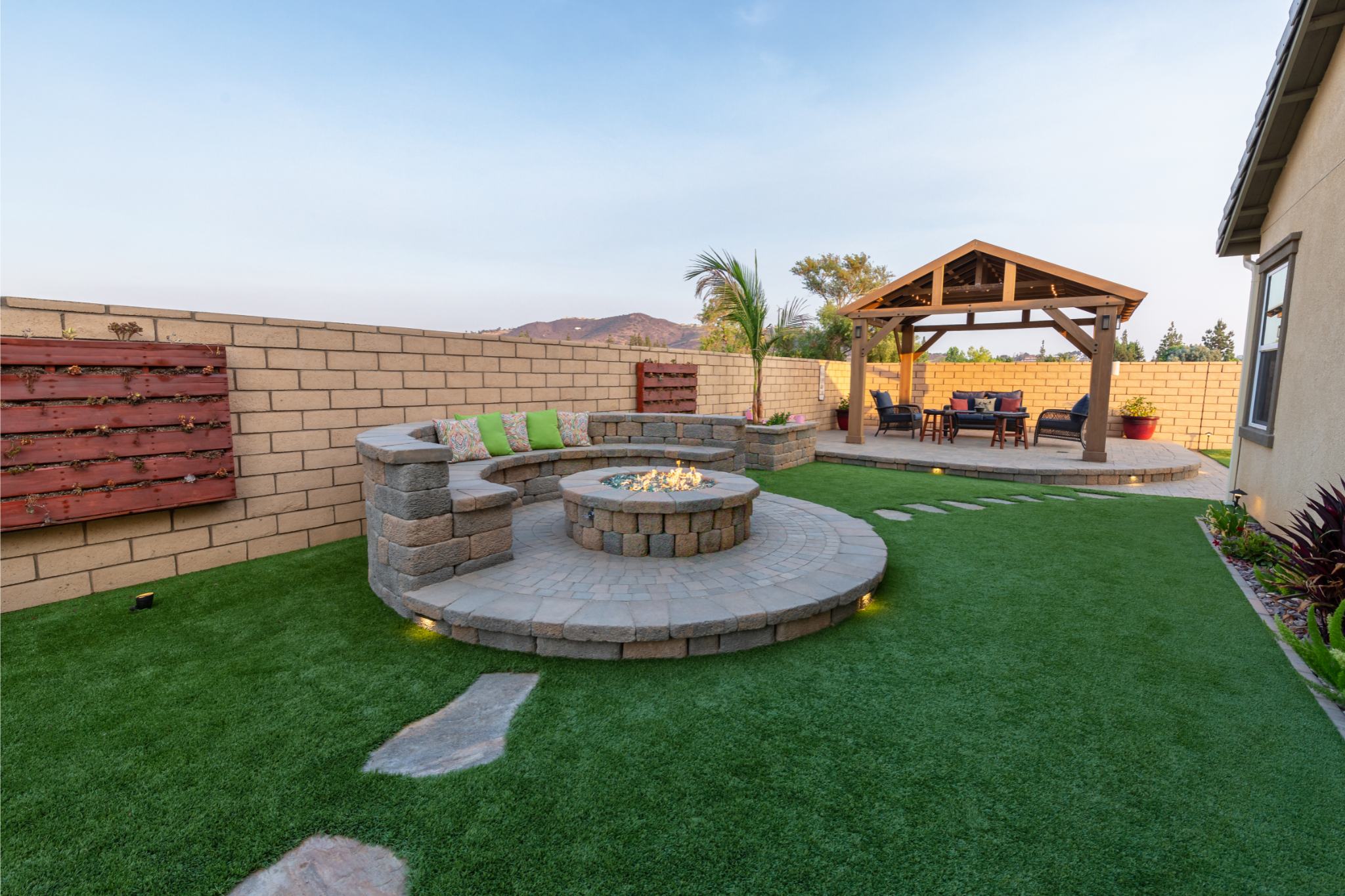 Completed backyard turf and paver installation by Coronado Turf in San Diego