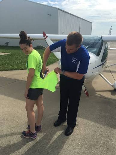 instructor cuts students shirt