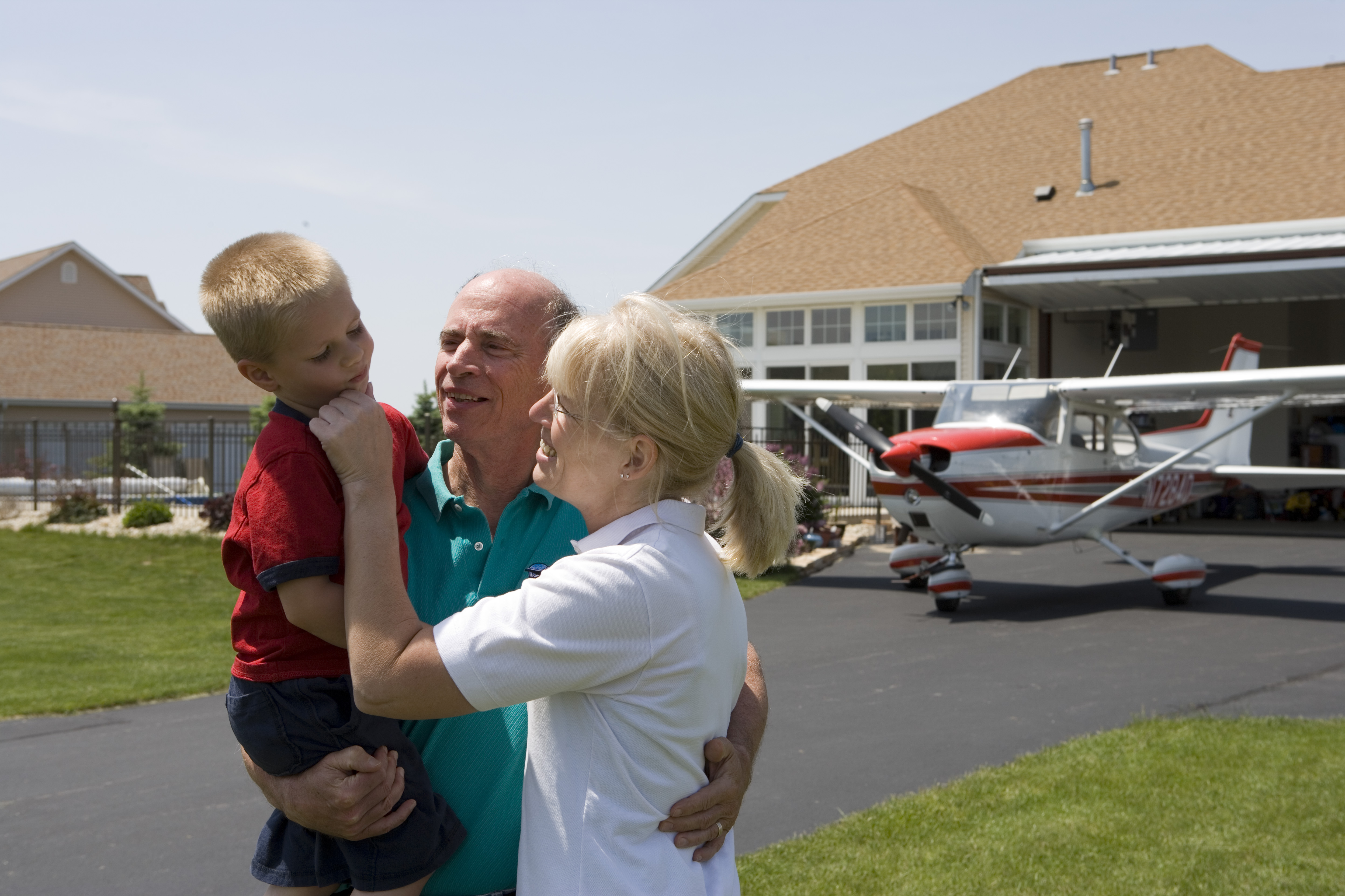 family in front of plane