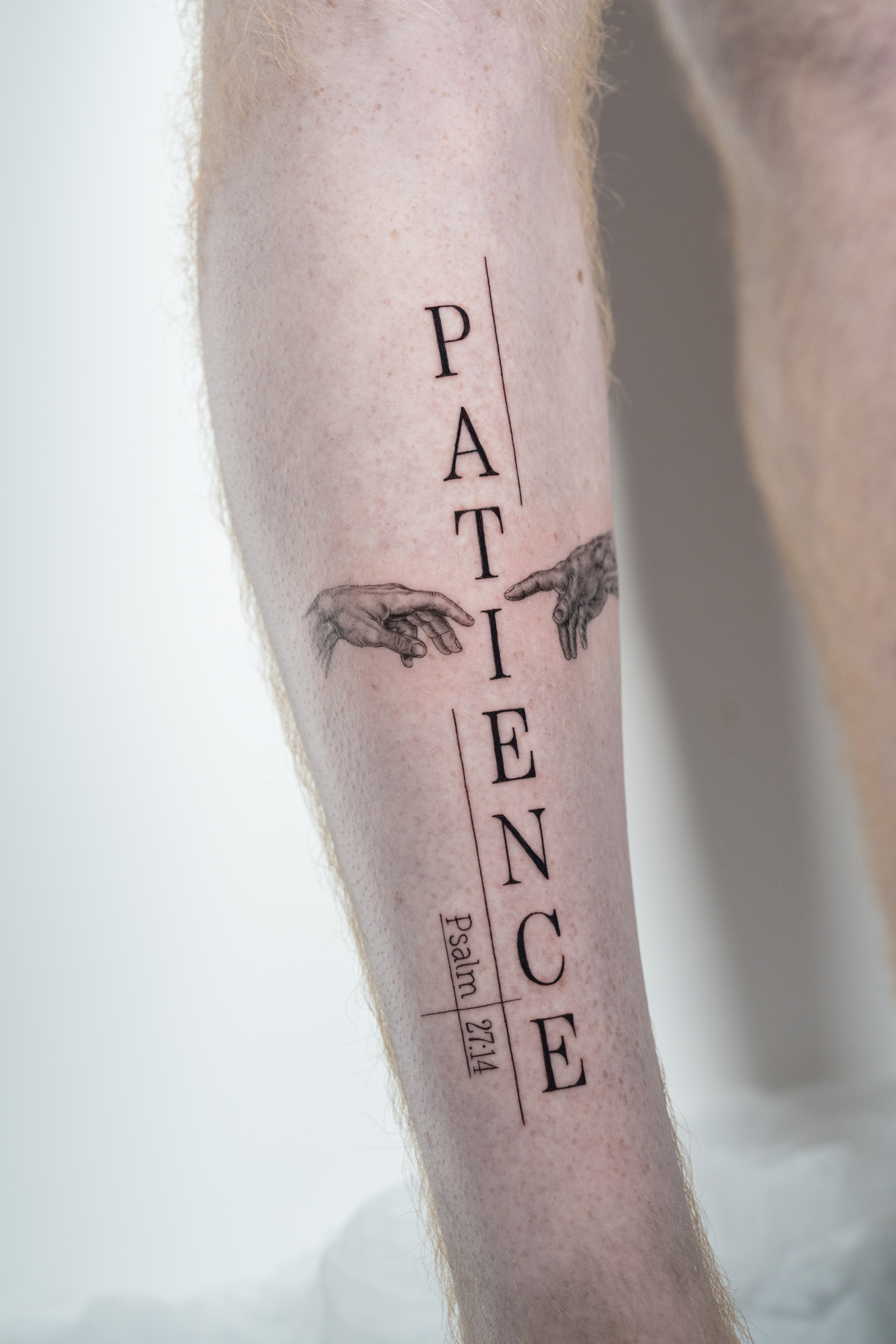 person with tattoo on right arm