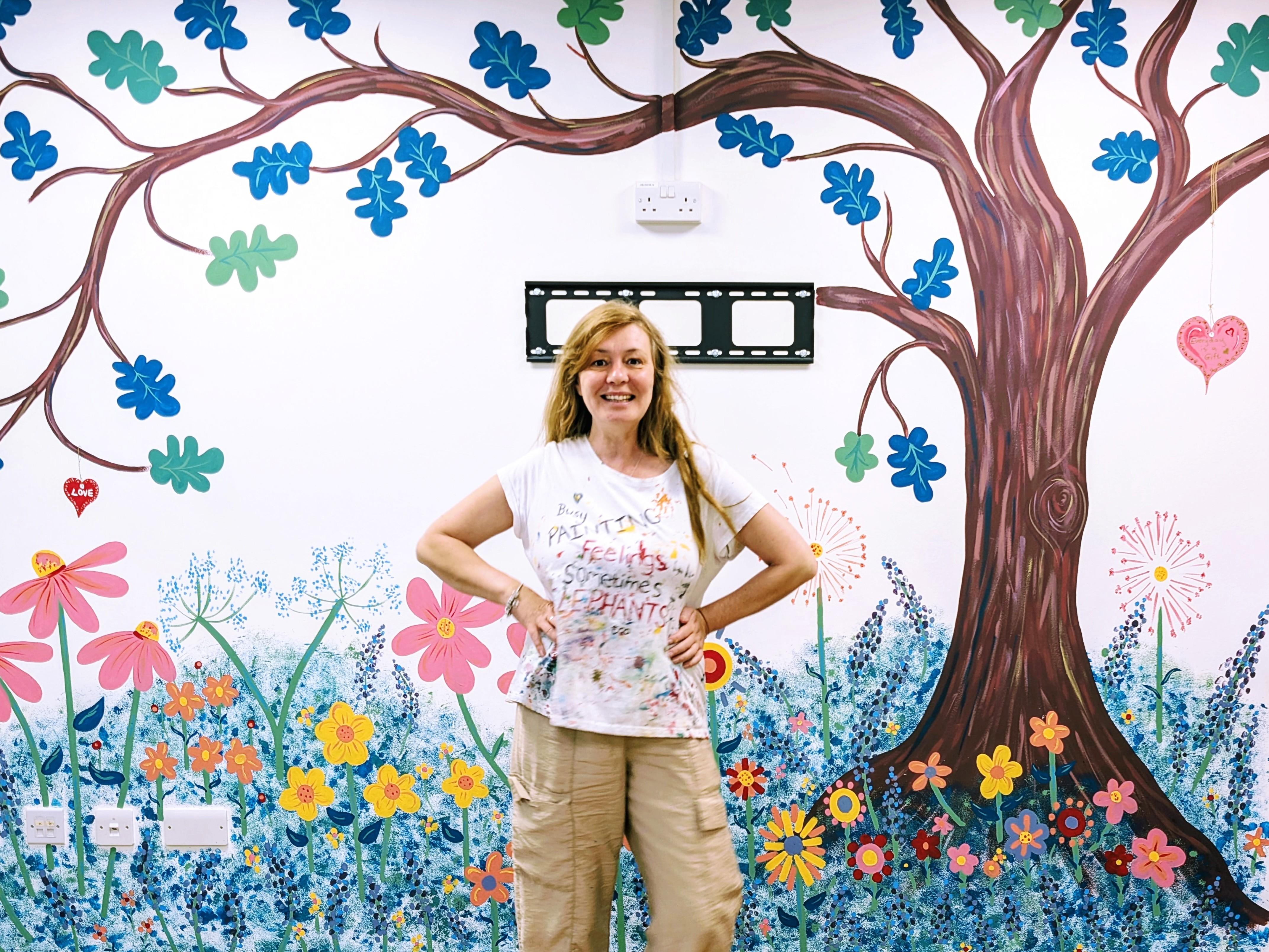 Janine Tonkin Art uplifted the Oaks children centre in bracknell with an Oak Tree standing in a bed of bright and beautiful bed of wild flowers.