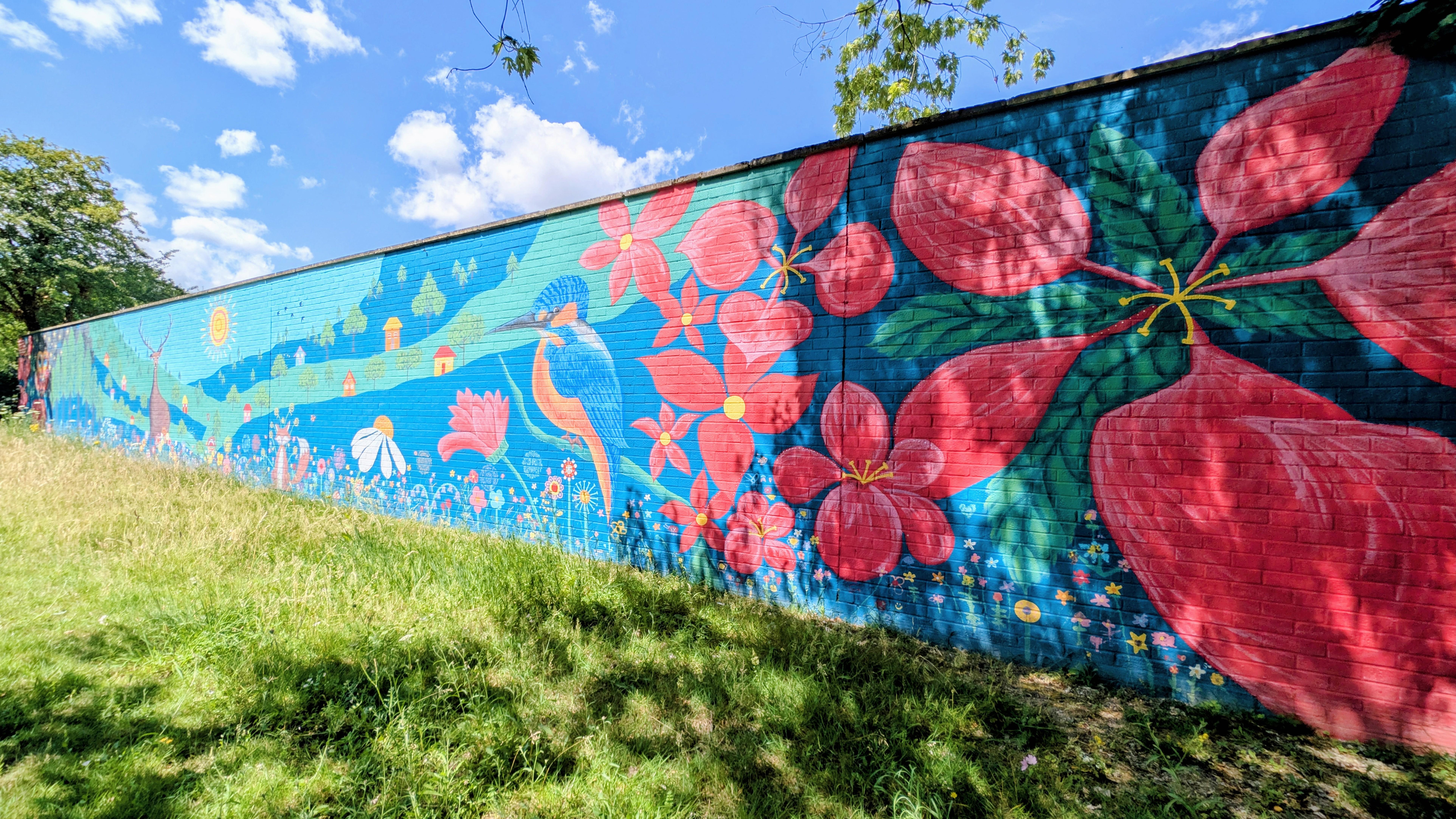Right perspective of the Wild & Wonder™ mural by Janine Tonkin™ at Campion House, Bracknell. Showcasing woodland flowers, kingfisher, hidden discoveries and nature-inspired storytelling through the Wild, Wonder & Bloom™ framework.