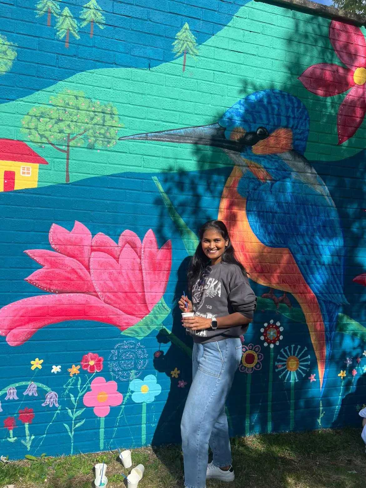 Budding artist Parimala Rachapudi adding their own creative contribution to the Wild & Wonder™ community mural by Janine Tonkin™