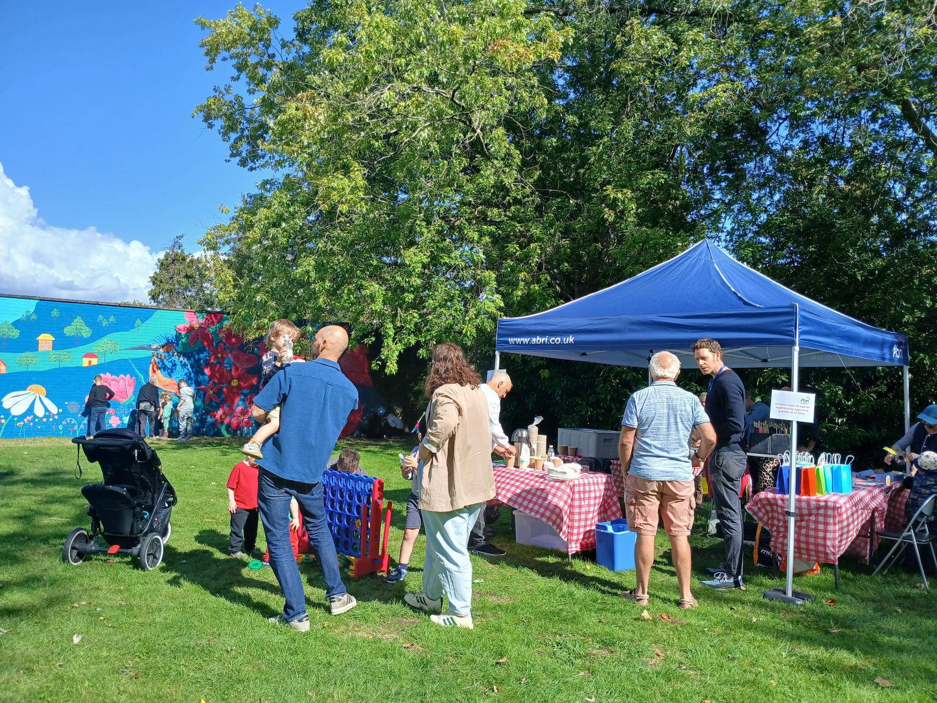 Community members enjoying the Wild & Wonder™ mural celebration at Campion House, Bracknell, bringing residents together through creativity, community engagement, and public art