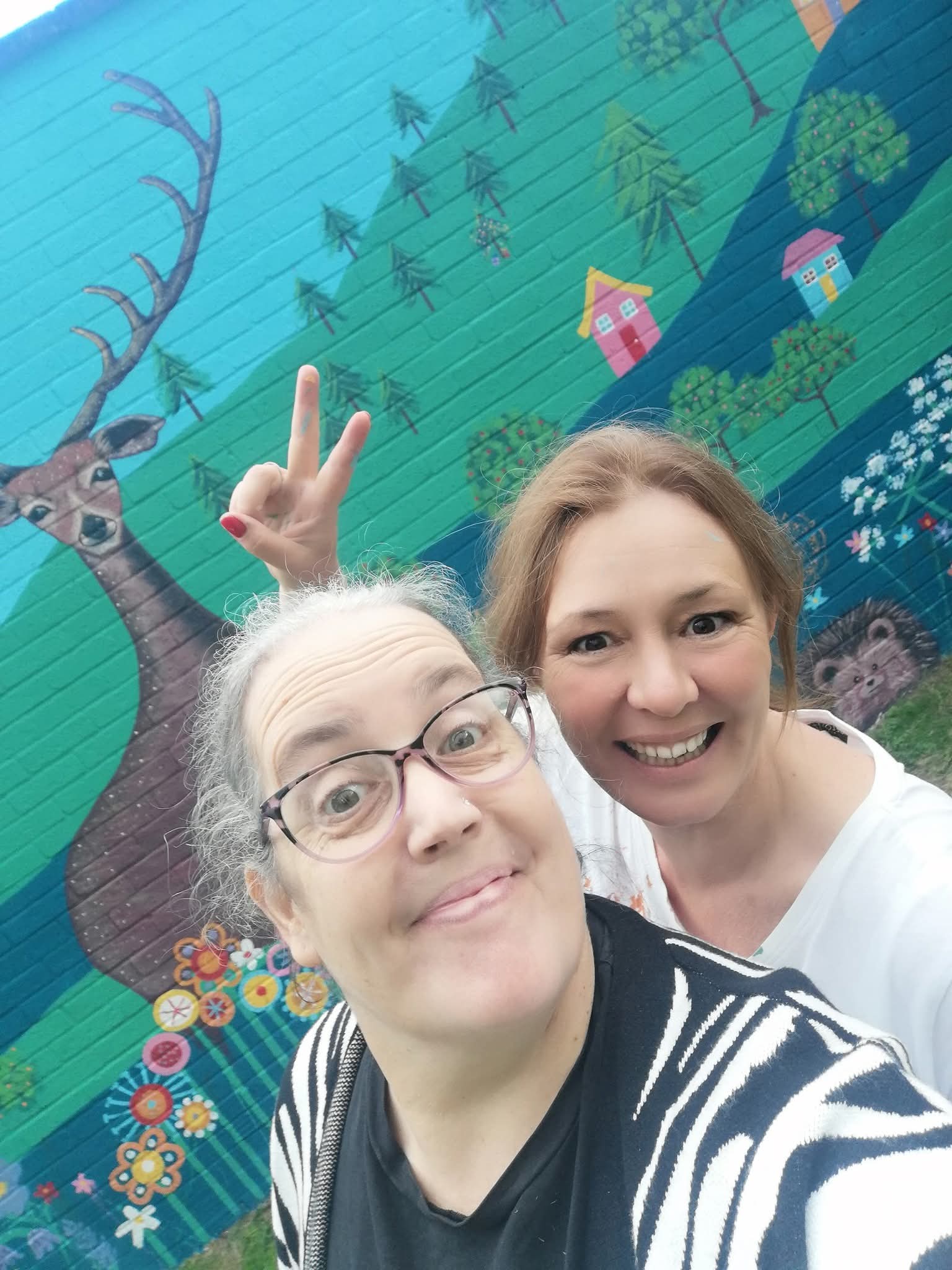 Resident Penny Atkinson and friend enjoying the Wild & Wonder™ community mural celebration with Janine Tonkin™