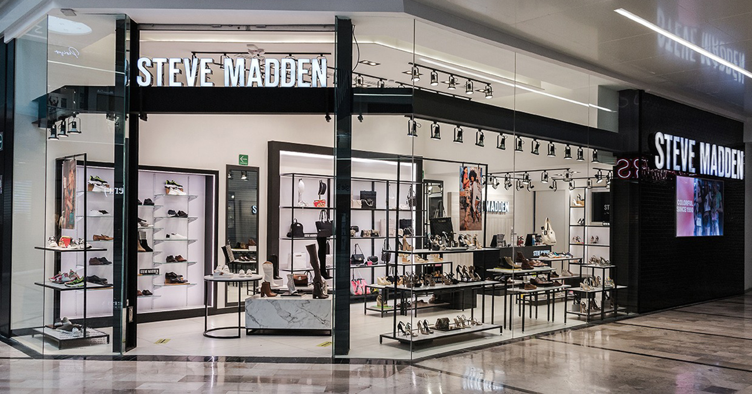 Wide shot of a modern Steve Madden retail store interior photo shoot