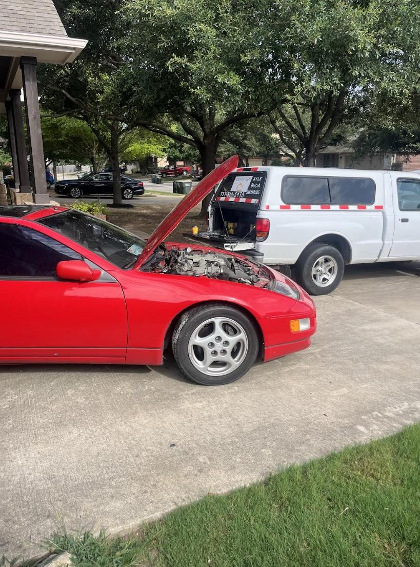 Mechanic inspecting air conditioning system