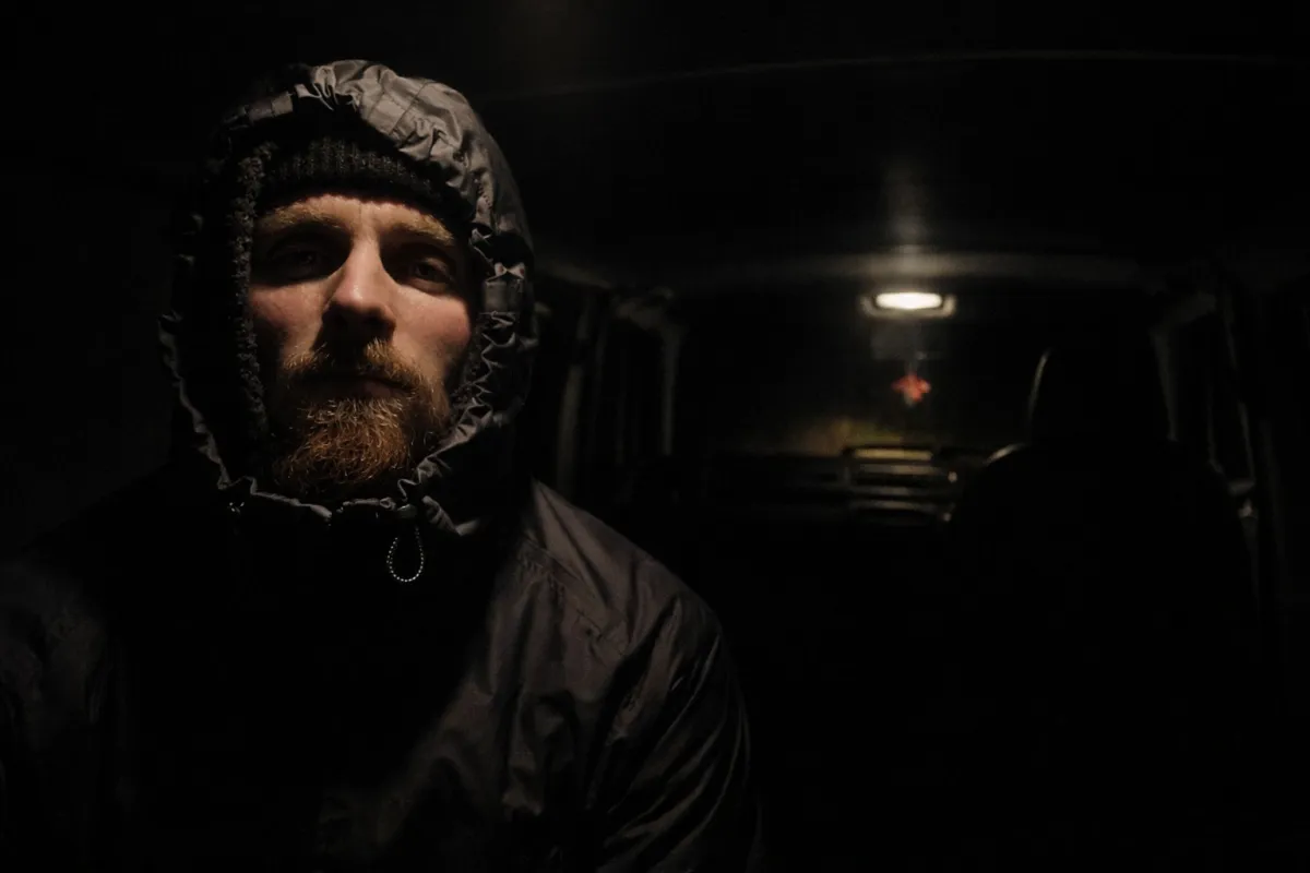 Grassy hill under a cloudy sky