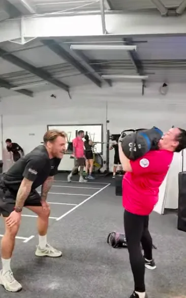 Heavy barbell strength training in a gritty high-performance gym