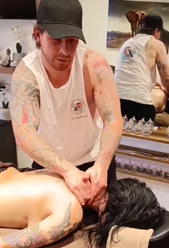 Hands-on soft-tissue treatment focusing on the knee area