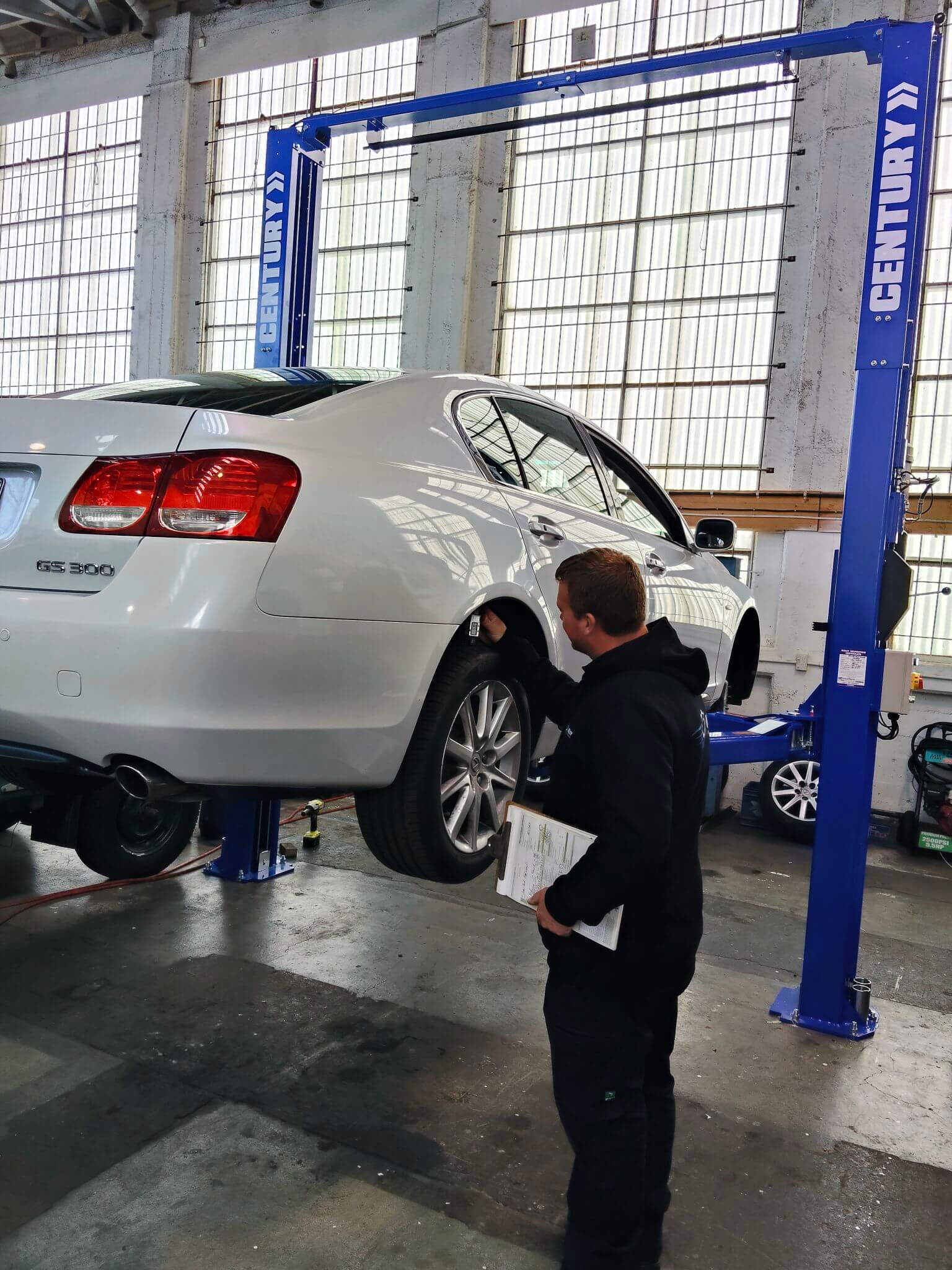 car on hoist WOF inspection Dunedin mechanic workshop