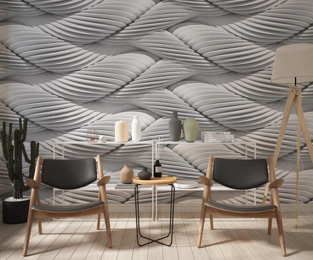 Three metal tweezers on a gray background.