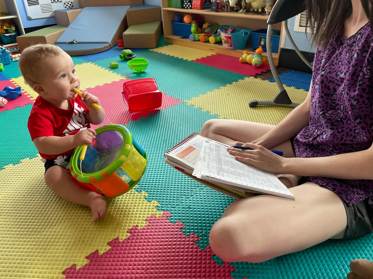 Teacher Working with Infant