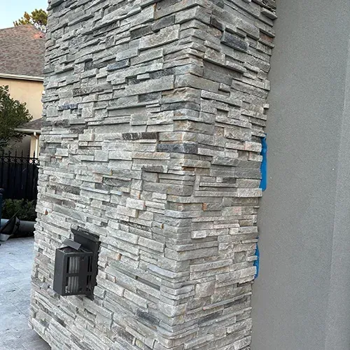 Stone veneer installation and durable stonework accents by M Z Masonry.