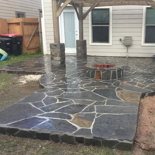 Stone paver patio and custom fire pit design by M Z Masonry