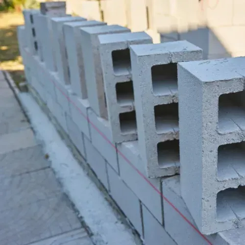 CMU block wall construction and repair with proper reinforcement.