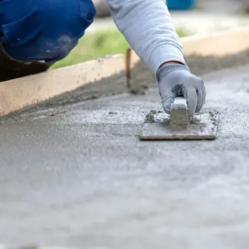 Concrete finishing with trowel and gloves, M Z Masonry concrete services in Houston, TX.