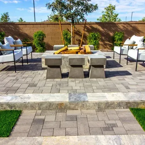 Paver patio and fire pit area with seating in Houston, TX