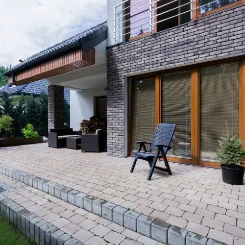 Paver patio and walkway installation in Houston, TX with natural stone pavers and clean edges.