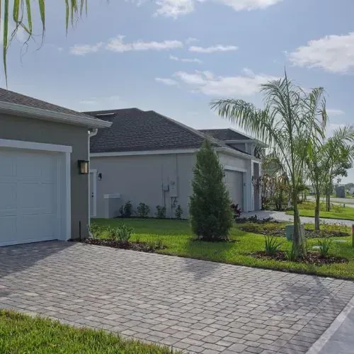 Paver driveway installation in Houston, TX with patterned pavers and smart drainage