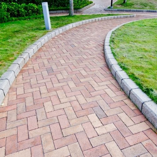 Paver walkway installation in Sugar Land, TX, enhancing curb appeal and safer outdoor spaces