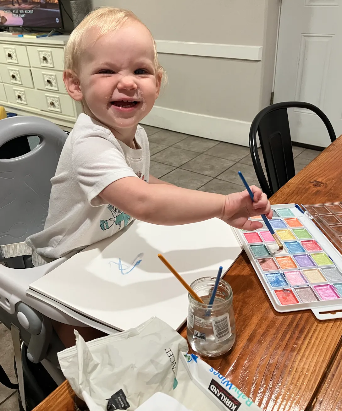 Girl follows directions during arts and crafts time.