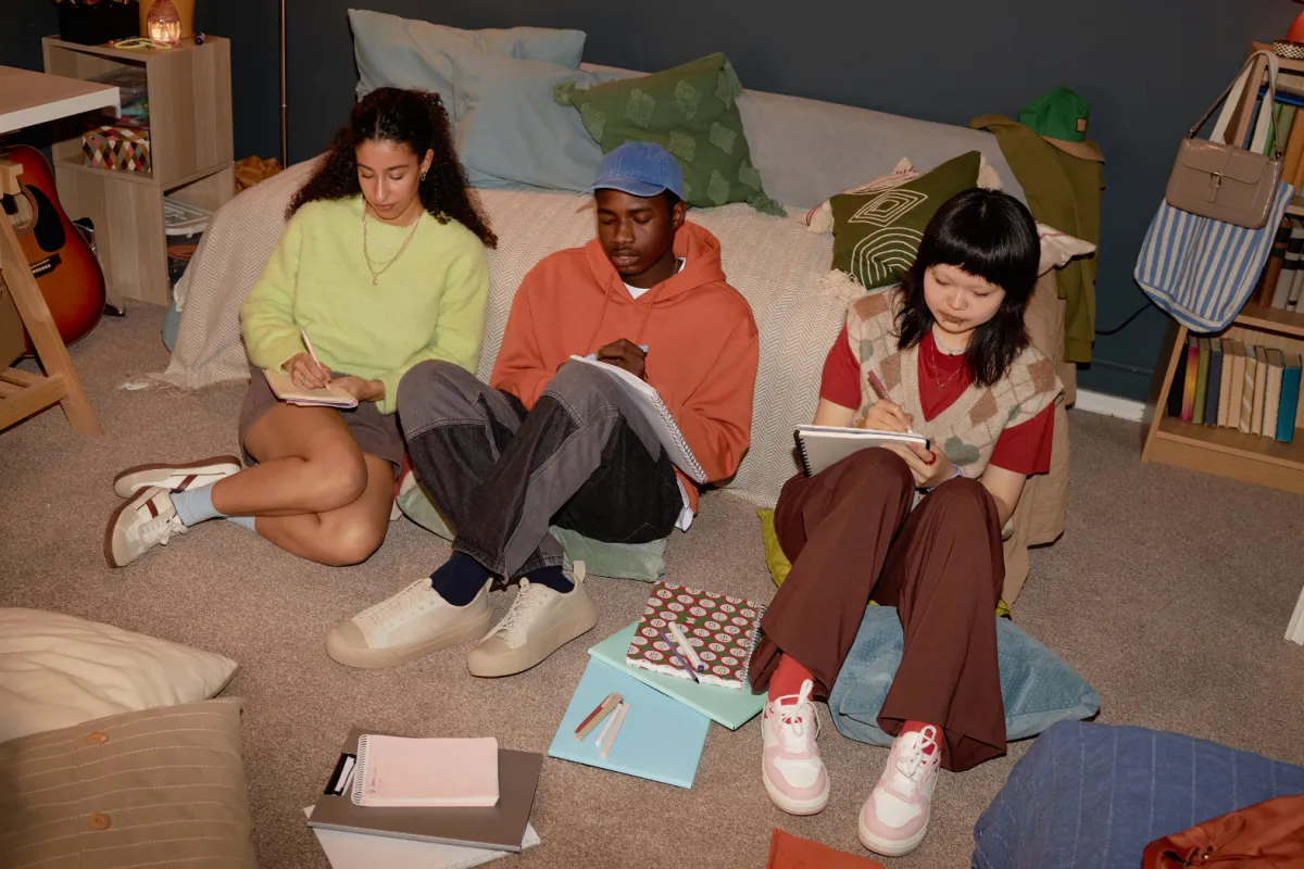 Students seated inside their dorm