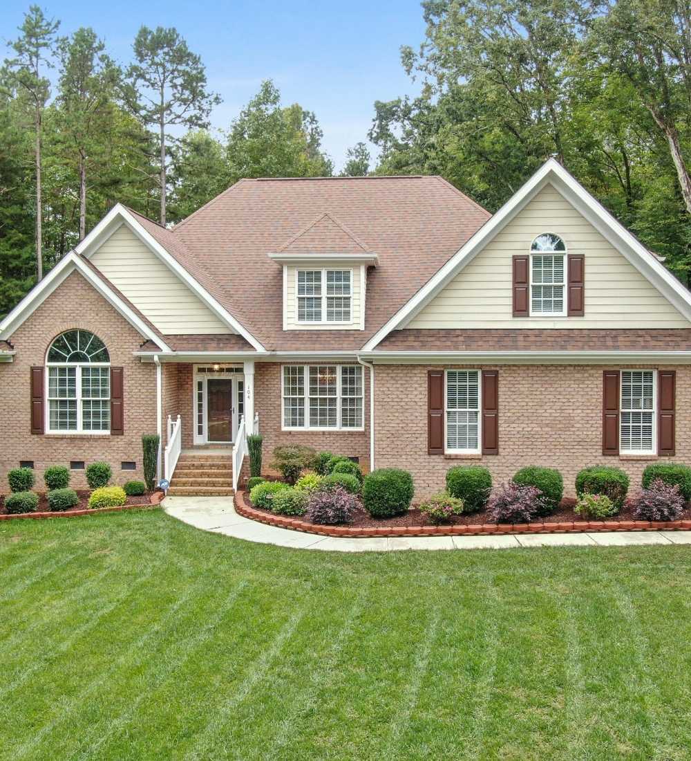 Lititz, PA house with shrubs in front of the house and a nice maintenance lawn
