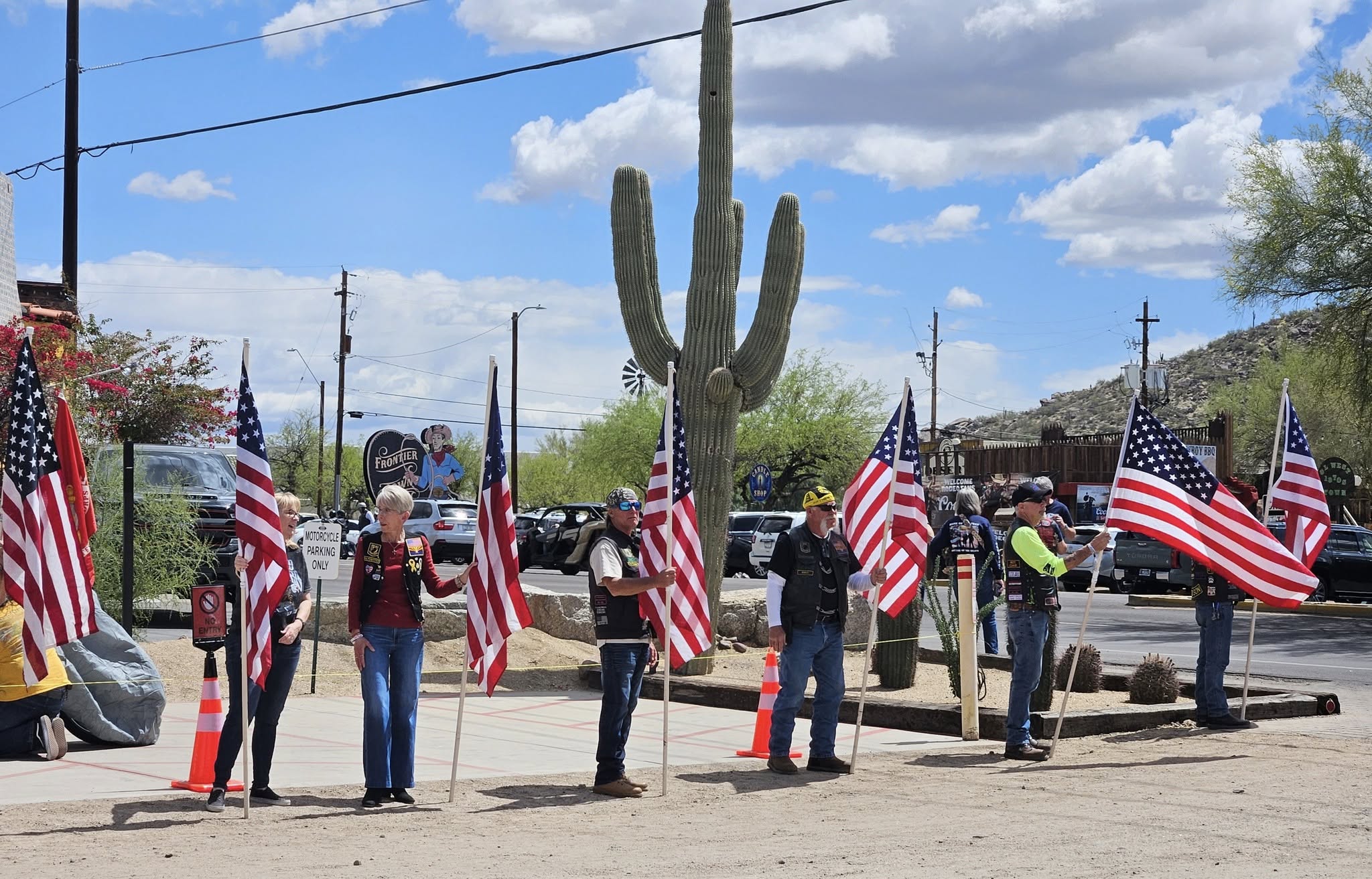 People gathered outdoors with ukrainian flag decorations