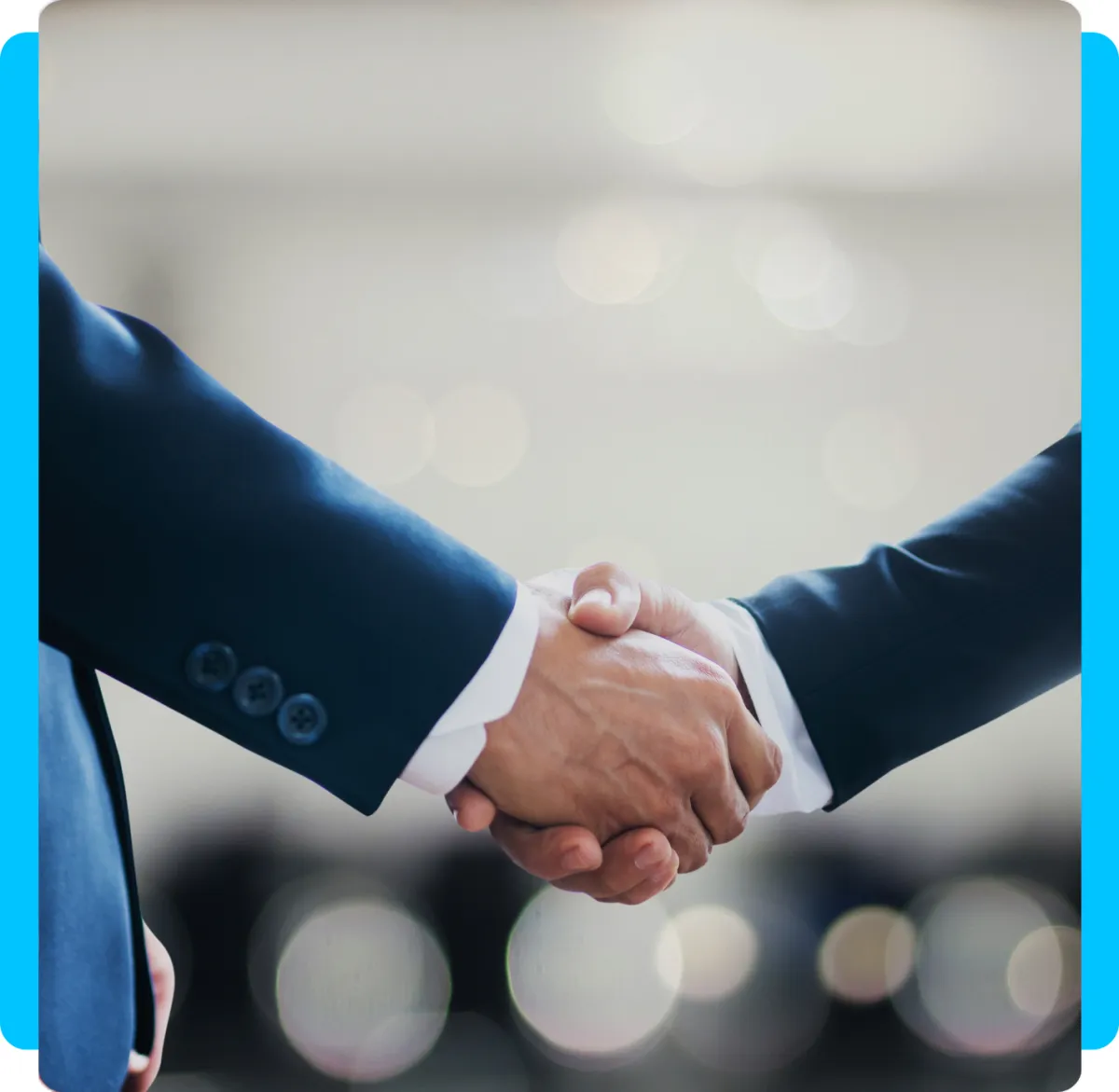 Two business professionals shaking hands, symbolizing strong relationships and collaboration