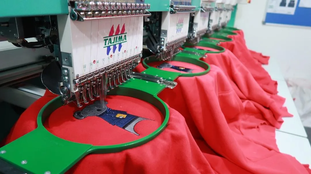 a close up of a black cloth with yellow dots