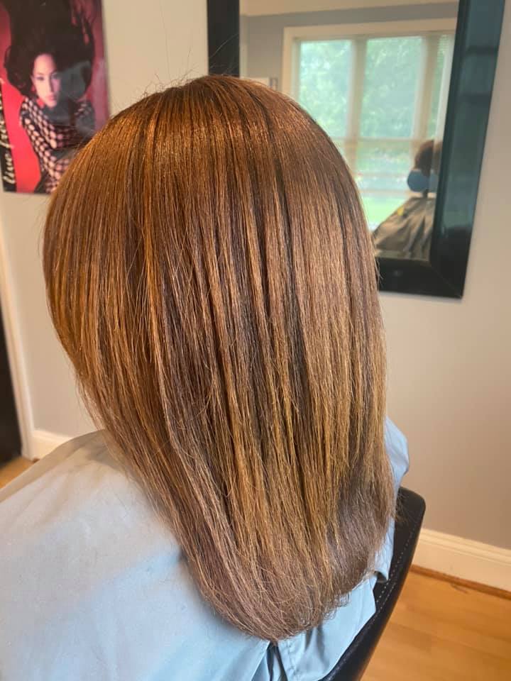 a living room filled with furniture and a fireplace