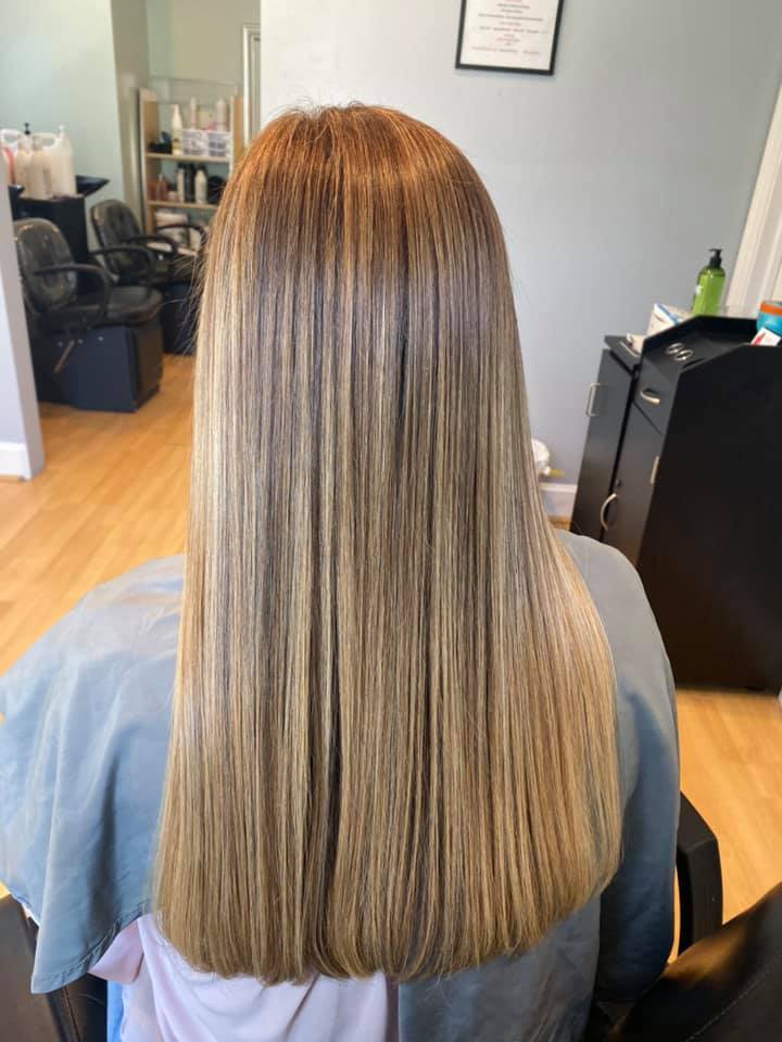 woman in white dress with white ribbon on head