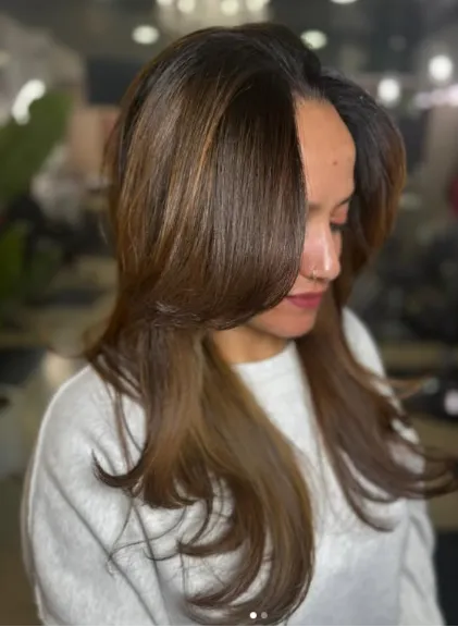 woman in white dress with white ribbon on head