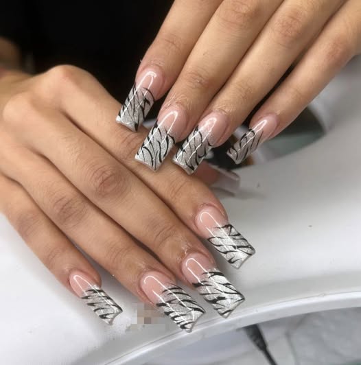 Young woman with long dark hair smiles